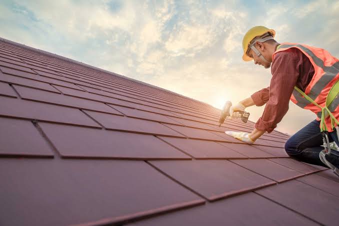 Flawless custom roofing services showing heavy duty leak barriers and step flashing on a complex roof junction.